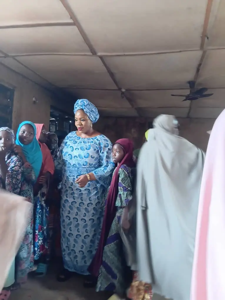 The Foundation's founder meets women and girls during a community visit